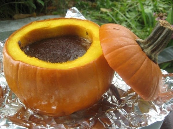These pumpkin brownies are actually baked inside a pumpkin! This is a fun and delicious recipe that can be the centerpiece of any fall or Halloween party.