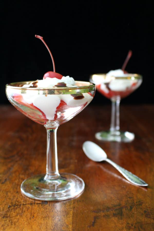 Try this delicious Vanilla Yogurt Sundae with Strawberries, Whipped Cream, Fudge Sauce, and a Cherry!