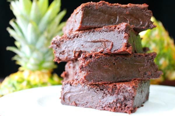 You'll love these incredibly fudgy pineapple brownies! Made with fresh pineapple and rum, they melt in your mouth with tropical chocolate flavors.