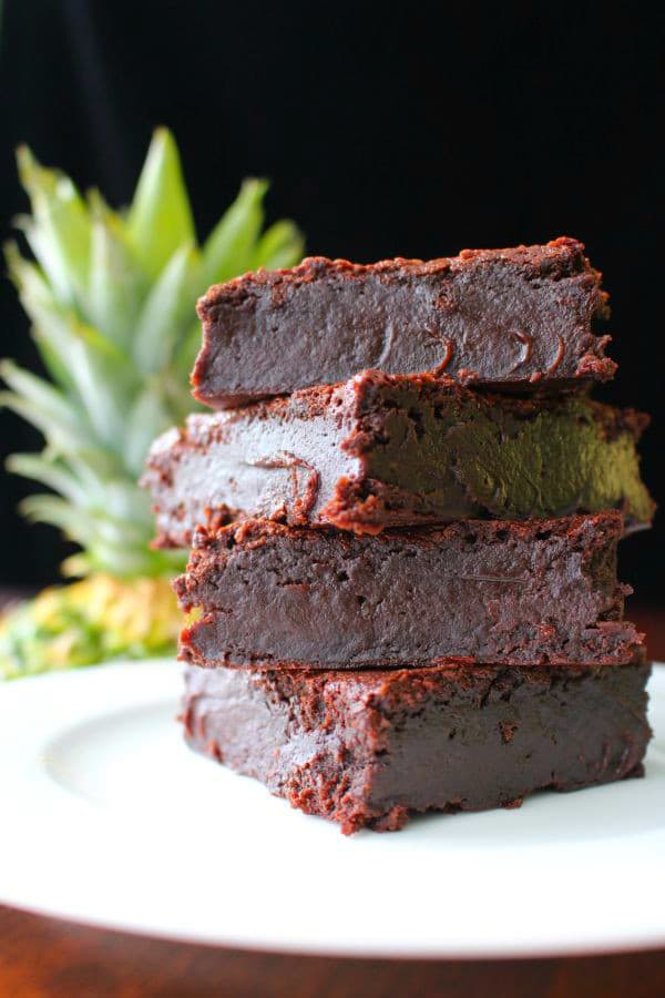 You'll love these incredibly fudgy pineapple brownies! Made with fresh pineapple and rum, they melt in your mouth with tropical chocolate flavors.