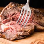 Bone-in rib roast with fork