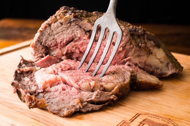 Bone-in rib roast with fork