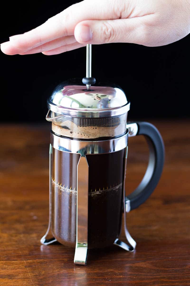 https://recipeforperfection.com/wp-content/uploads/2016/02/How-to-make-French-press-coffee-pressing-the-plunger.jpg