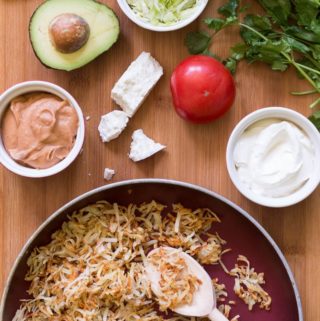 Set up your own hashbrown taco bar with crispy hash browns, chipotle spiced refried beans, and all the tasty toppings! Perfect for dinner with the family.