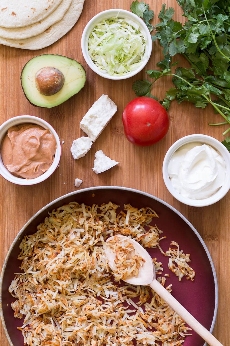 Set up your own hashbrown taco bar with crispy hash browns, chipotle spiced refried beans, and all the tasty toppings! Perfect for dinner with the family.