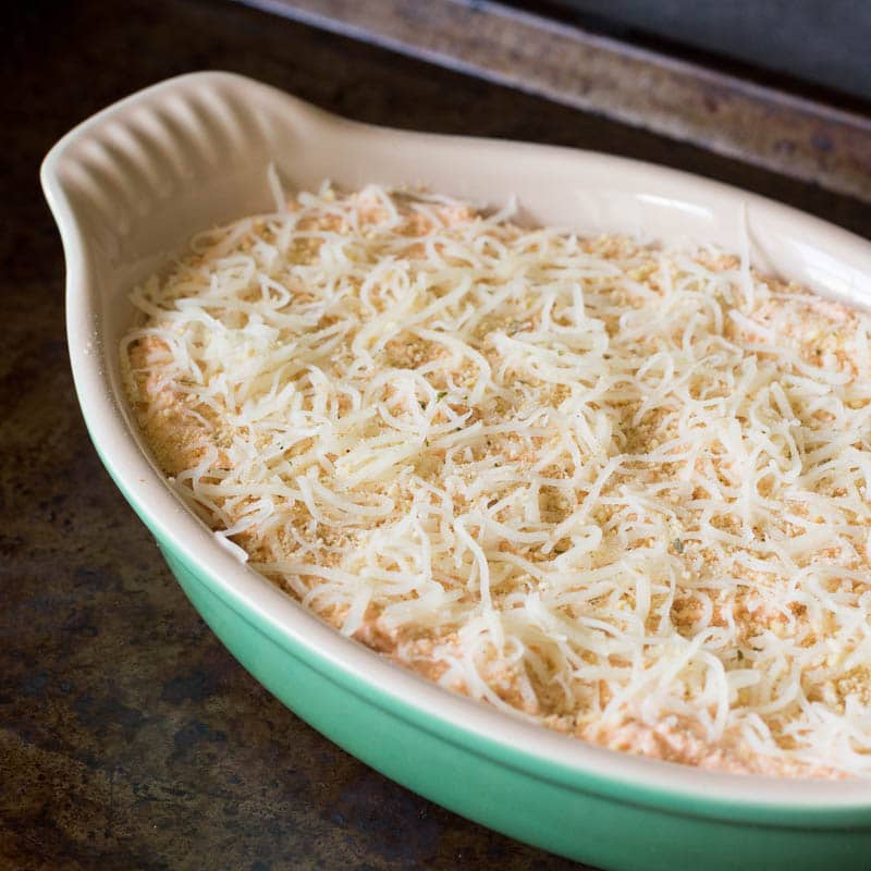 This creamy parmesan rosa baked artichoke dip is full of rich, cheesy goodness with just the perfect tang of tomato flavor. Bake it today and enjoy!