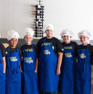 Local students who participated in the Florida Dairy Farmers Gridiron Cooking Challenge prepared a celebratory dinner at Cress Restaurant in Deland, FL.