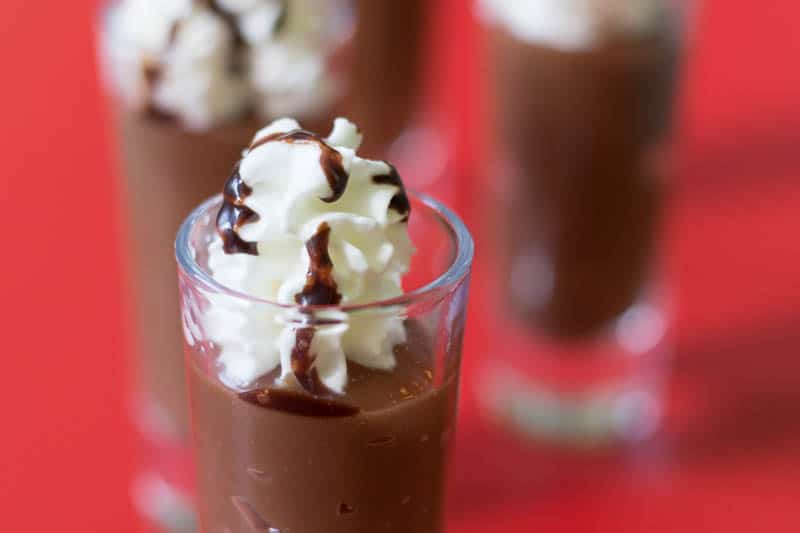 Make a dessert shooter just like a fancy coffee drink with a simple combination of coffee pudding, whipped cream, and chocolate syrup. Easy and delicious!
