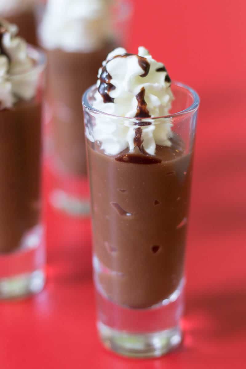 Make dessert shooters just like a fancy coffee drink with a simple combination of coffee pudding, whipped cream, and chocolate syrup. Easy and delicious!
