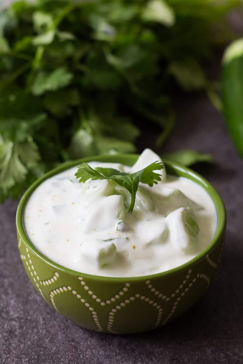 This cucumber raita recipe is made with whole milk yogurt, cumin, cilantro and seedless cucumbers. A perfectly cool and refreshing dip!