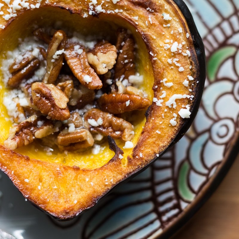 Rich, sweet roasted acorn squash doused in maple butter and filled with maple butter roasted pecans, then topped with blue cheese crumbles.