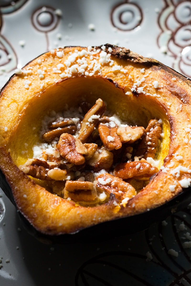 Rich, sweet roasted acorn squash doused in maple butter and filled with maple butter roasted pecans, then topped with blue cheese crumbles.
