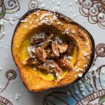 Rich, sweet roasted acorn squash doused in maple butter and filled with maple butter roasted pecans, then topped with blue cheese crumbles.