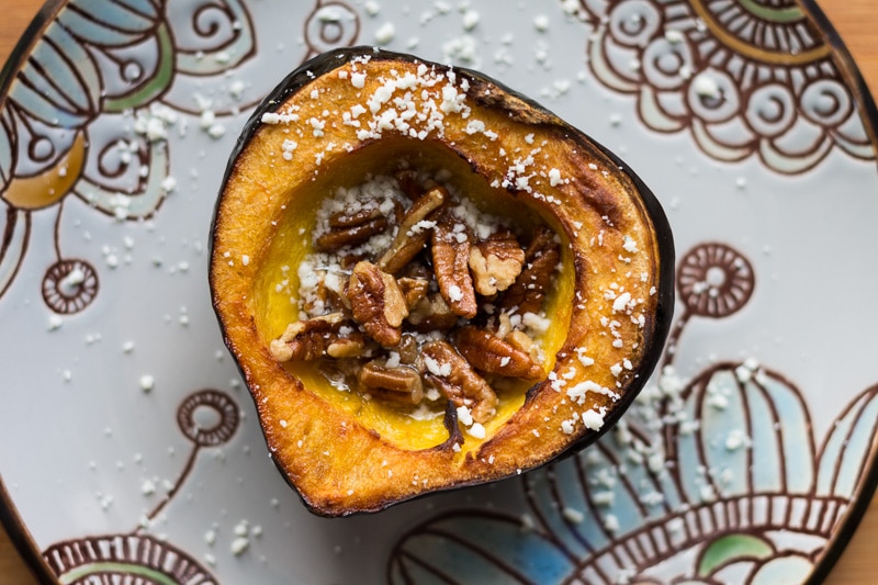 Rich, sweet roasted acorn squash doused in maple butter and filled with maple butter roasted pecans, then topped with blue cheese crumbles.
