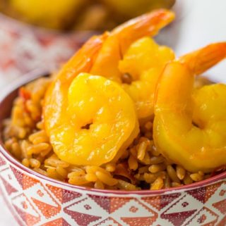 Sauteed saffron shrimp are a beautiful yellow color with a delectable flavor. Ready in just minutes with a simple white wine and saffron marinade!