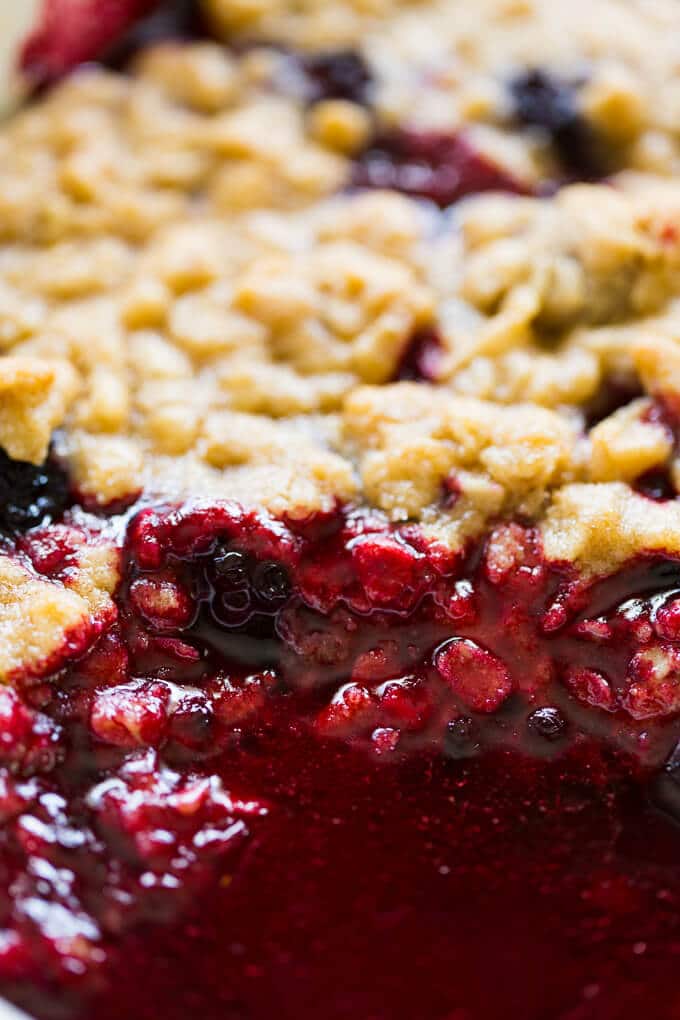 Closeup inside blackberry crumble with juice