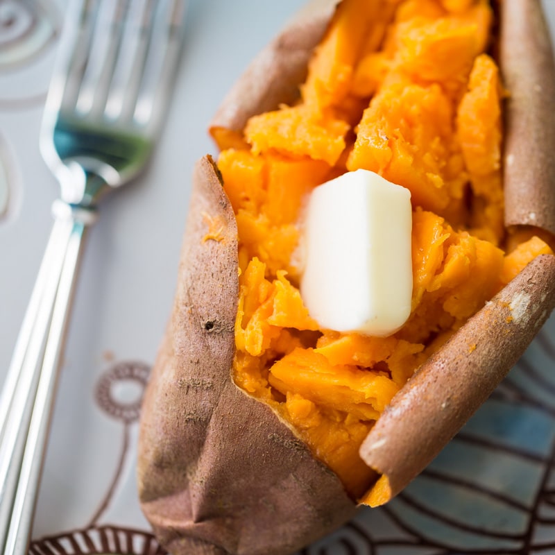 The only recipe you'll ever need for baked sweet potatoes. Crispy on the outside, fluffy on the inside. Top with butter and sea salt for pure perfection.