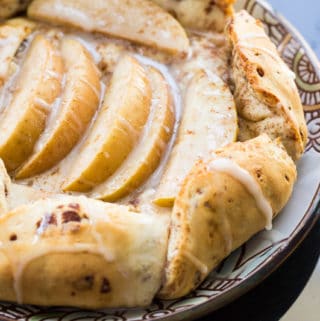 This cinnamon roll apple galette is a fun twist on the traditional French galette, using cinnamon roll dough wrapped around apples.