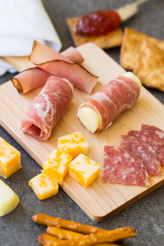 Charcuterie board with prosciutto, maple ham, salami, and cheese