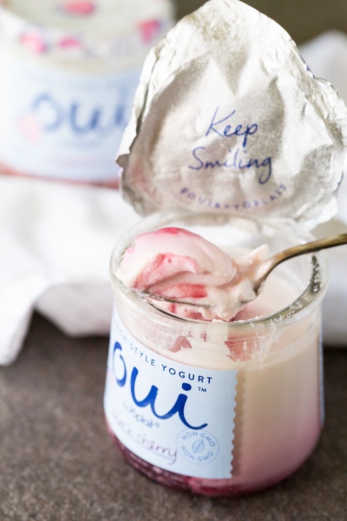 Spoonful of French yogurt with strawberries on a silver spoon