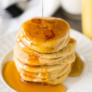 Silver Dollar Hamcakes Recipe - Mini Pancakes with Ham and Maple Syrup on a white plate