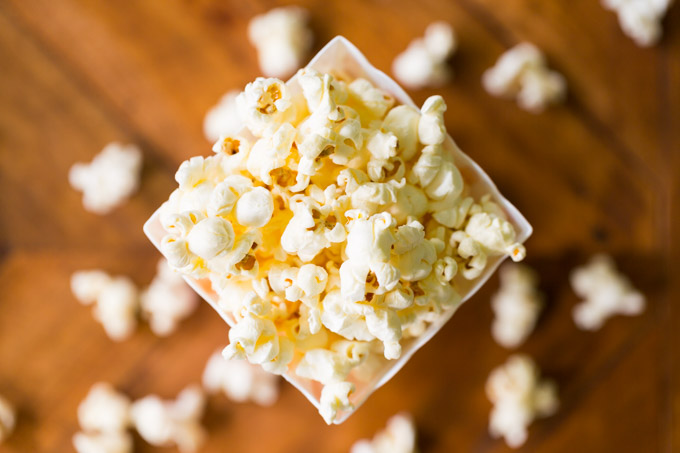 Top of a bucket of popcorn on a wooden table