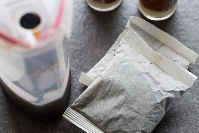 Cold brew coffee filter packs with a pitcher and glasses