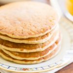 Breakfast of oat flour pancakes and orange juice