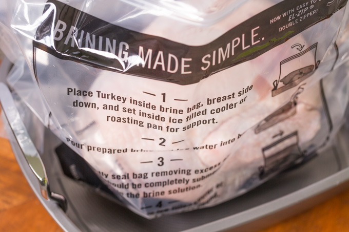 Thawed whole turkey in a plastic brine bag