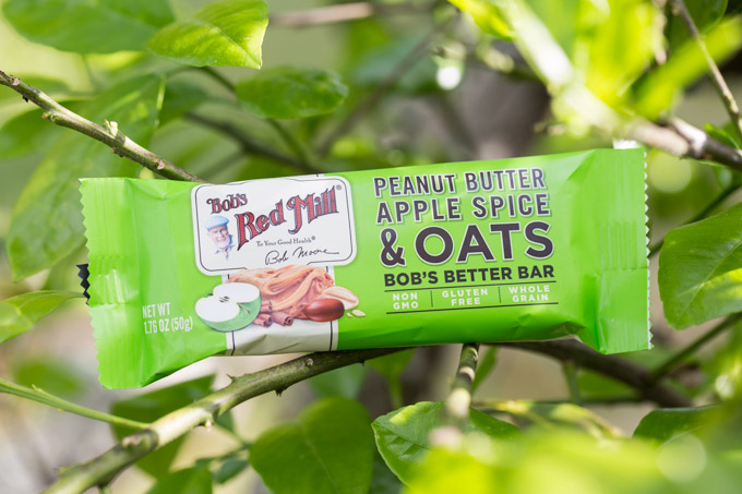 Packaged granola bar sitting on a tree branch