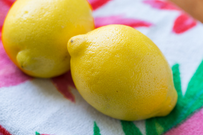 Lemons for making lemonade iced tea on a colorful beach towel