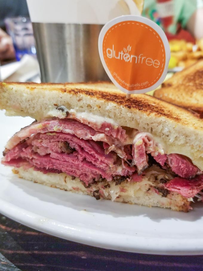 Reuben sandwich on a white plate at Friedmans NYC