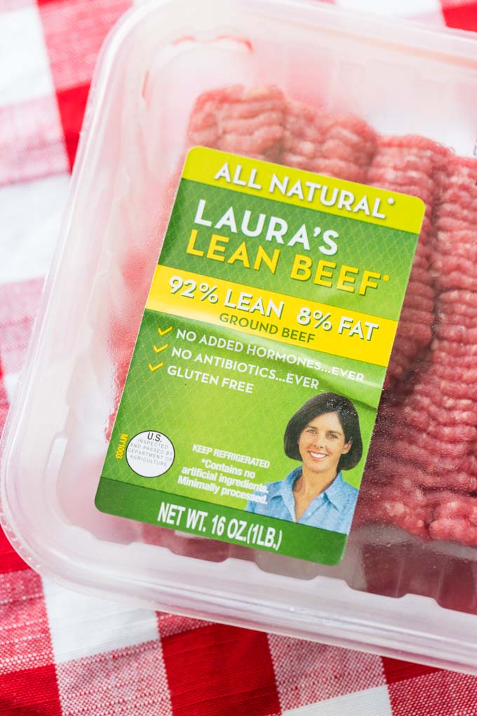 Package of Laura's Lean Beef ground beef on a red and white checked tablecloth