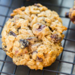 Gluten free cowboy cookies on a black wire cooling rack